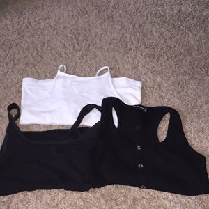 2 black tank top crops, 1 white tank top crop